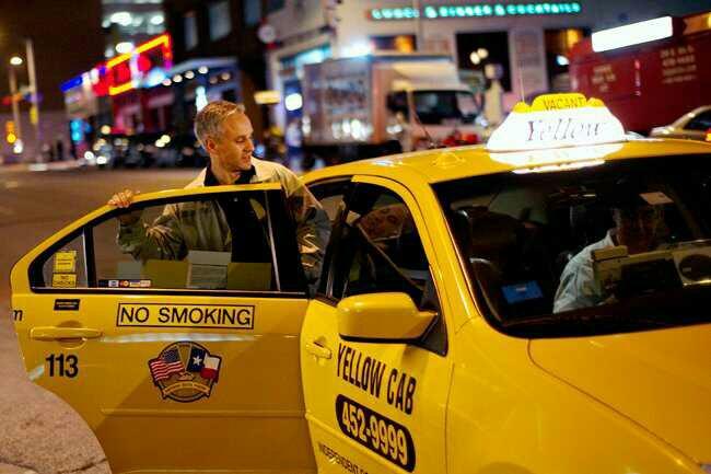 When you take a taxi , you set in the back or front?