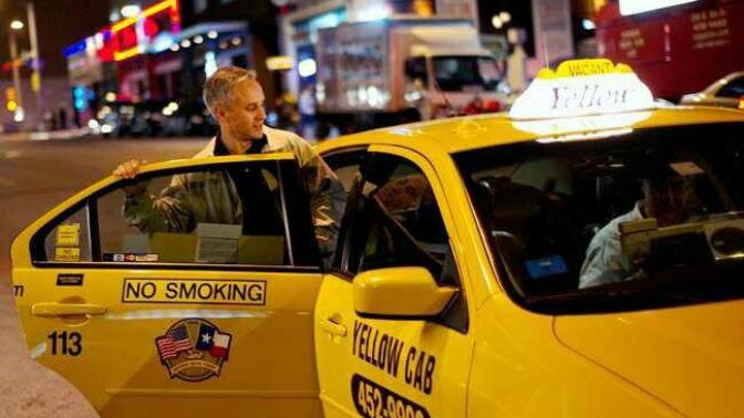 When you take a taxi , you set in the back or front?