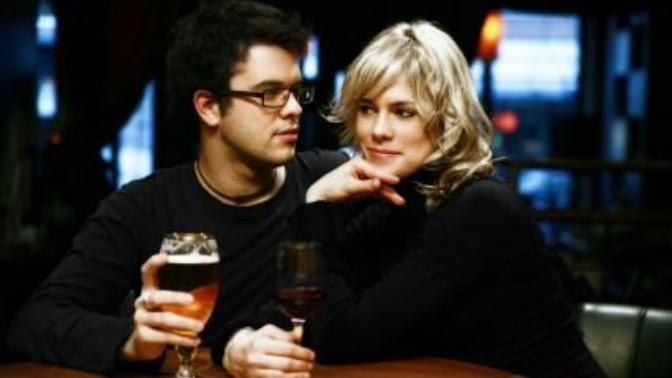 What are some definite signs that a woman is interested in a guy?