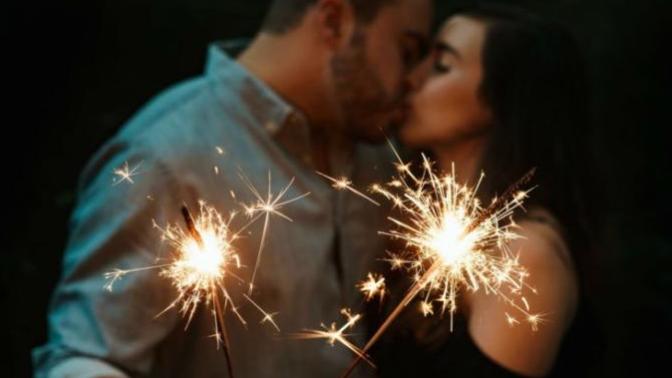 Why do people kiss at midnight on New year's eve?