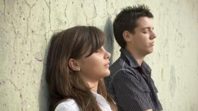Does your crush act different with you when other people are around?