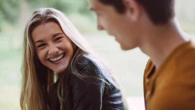 Best flirting techniques I can do with a girl during a in person conversation without seeming too much?