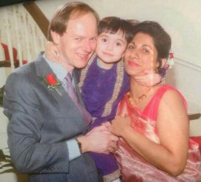 Do she look more like her Dutch father or her indian mother?