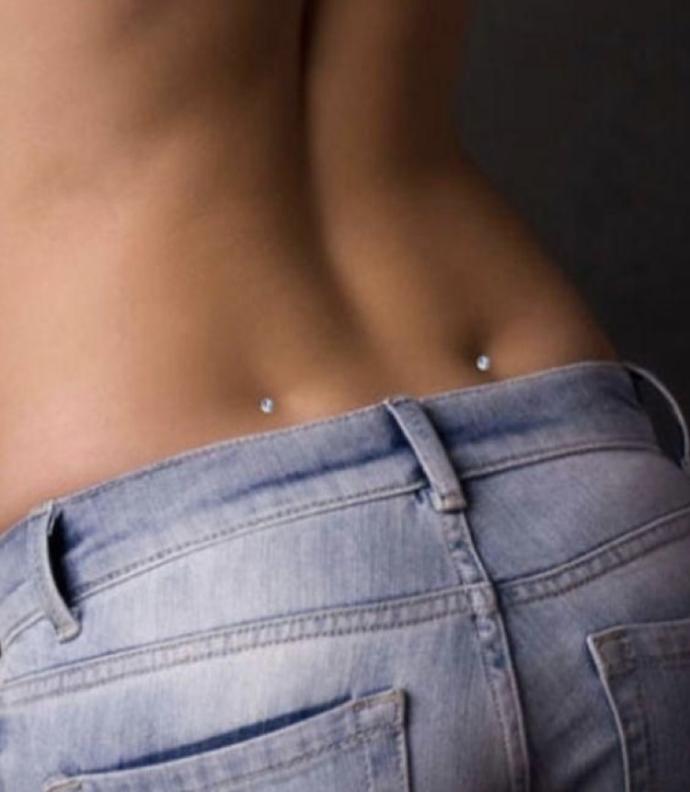 Guys, do you think pierced back dimples are attractive?