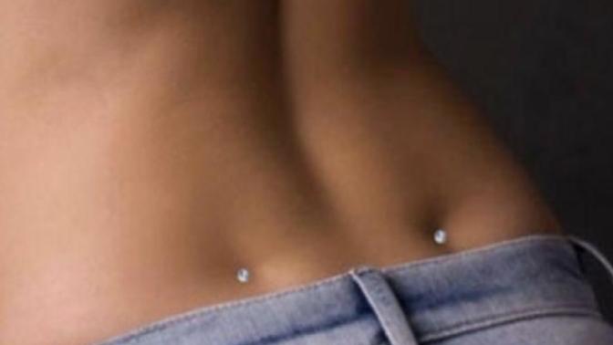 Guys, do you think pierced back dimples are attractive?