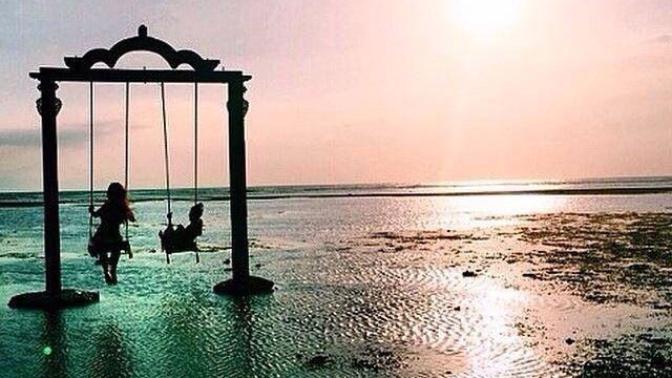 Would you want to swing above the water in the Gili Islands?