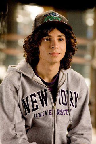 Does the combination of long curly hair and cap look good?