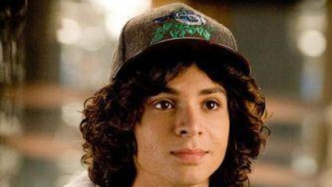 Does the combination of long curly hair and cap look good?