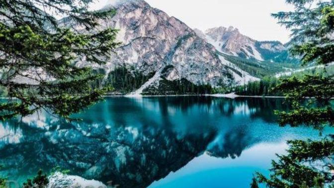 Why do humans often associate beauty with morality?
