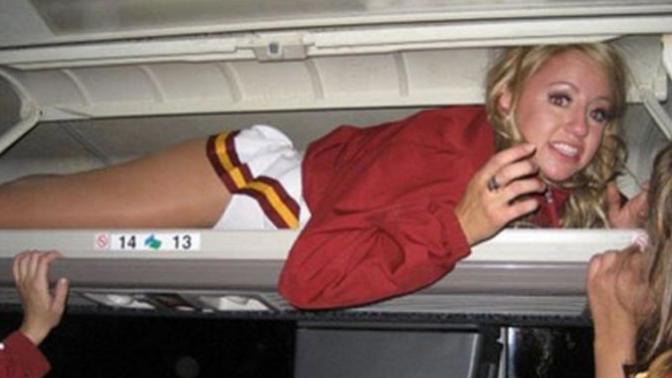 What kinds of strange things have you put into the overhead bin of airplane and why is this girl in one?