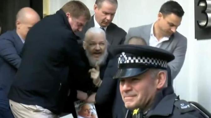 Julian Assange dragged out of Ecuadorian Embassy in London, in tears, and arrested! Thoughts?
