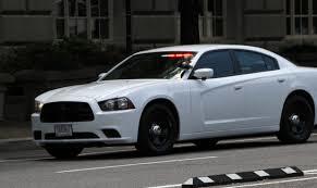 Unmarked Cruiser flashing lights. Is it Police or not?