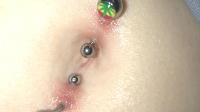 Is my belly button piercings rejecting?