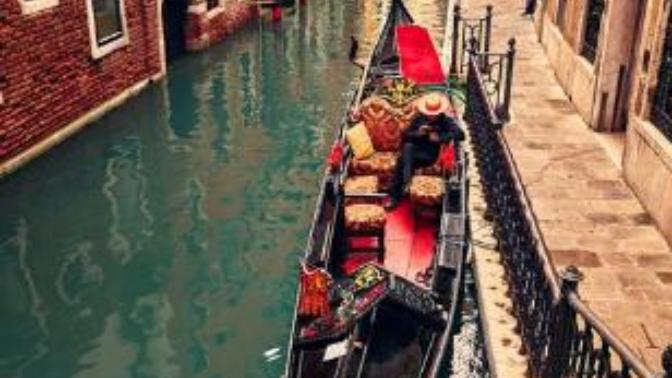 Would you flirt with an attractive stranger on a boat in Venice?