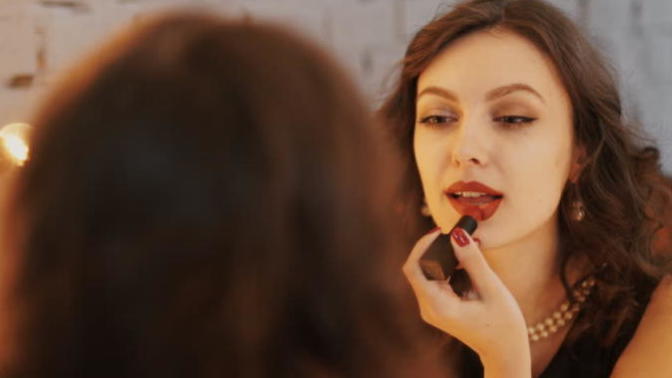 Girls, what do you think about when you are putting on lipstick in the bathroom?