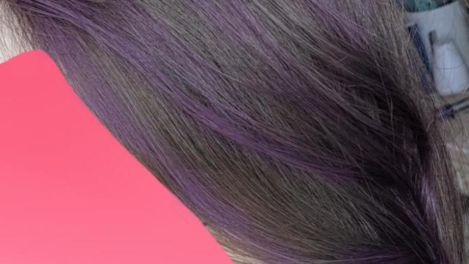 I just impulsively put a bunch of purple streaks through my hair. How's it look?