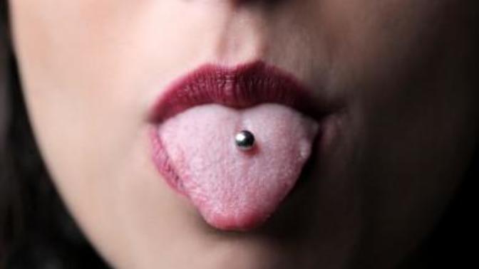 Should I wear my tongue piercing to a restaurant interview?