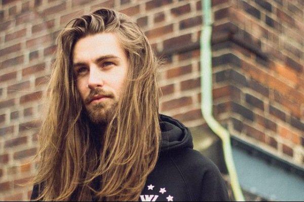 How common is it for men to have long hair in your country?