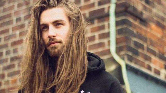How common is it for men to have long hair in your country?