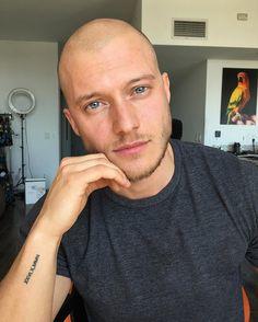 A lot of guys are shaving their heads these days. Which male model pulls it off better?
