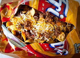 When making frito pies, should the Fritos go on top of everything or the bottom of everything?
