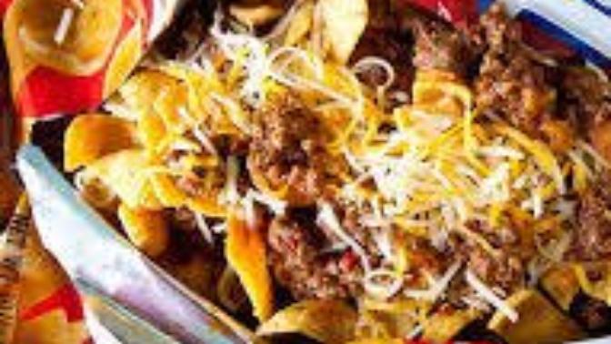 When making frito pies, should the Fritos go on top of everything or the bottom of everything?