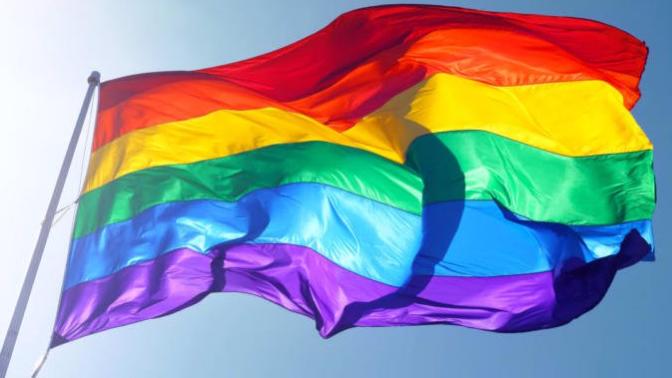 My friend says using the rainbow as a gay symbol is blasphemy. Is she right?