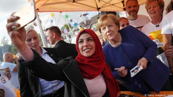 How well do your fellow citizens treat the immigrants in your country?