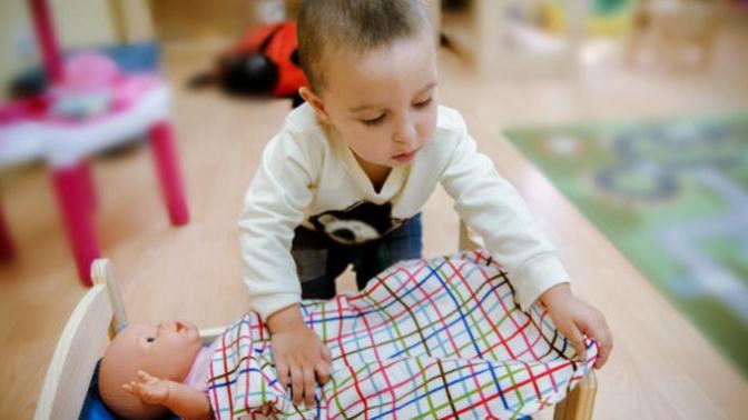 Would you give a baby doll to a boy?
