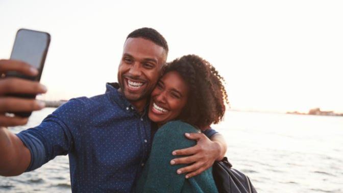 Should I tell my friend to keep our relationship private and to take down the pictures of us together?