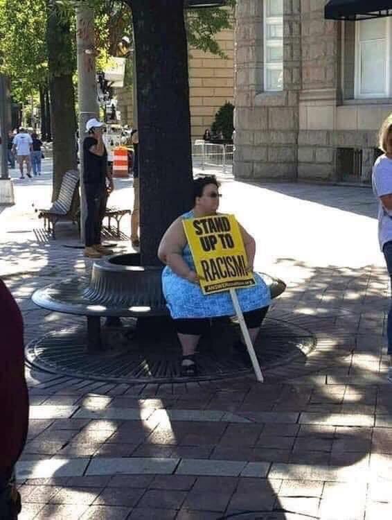 What does this protester want us to do?