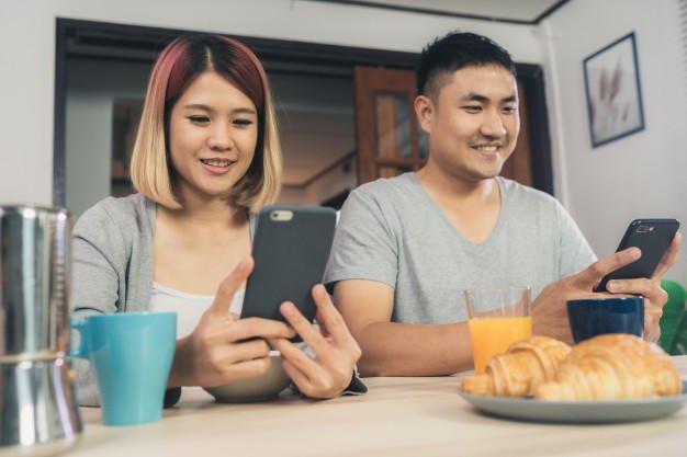 Who spends more time on the phone: men or women?