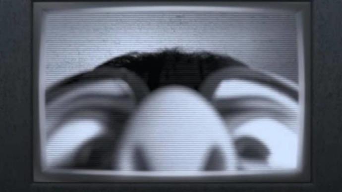 Edna Mode, The Incredibles, looking at her securty cam