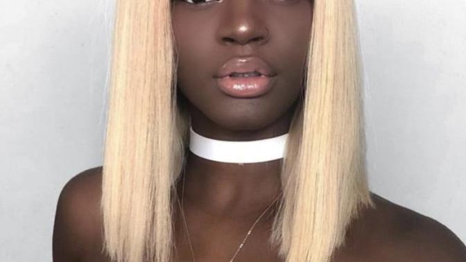 Why do dark skin women wear wigs?