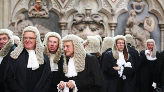 Why do British judges wear wigs?