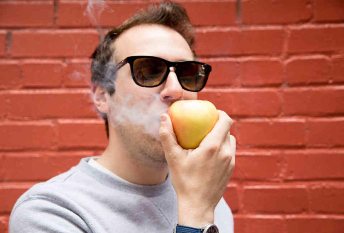 A guy smoking fruit :-I