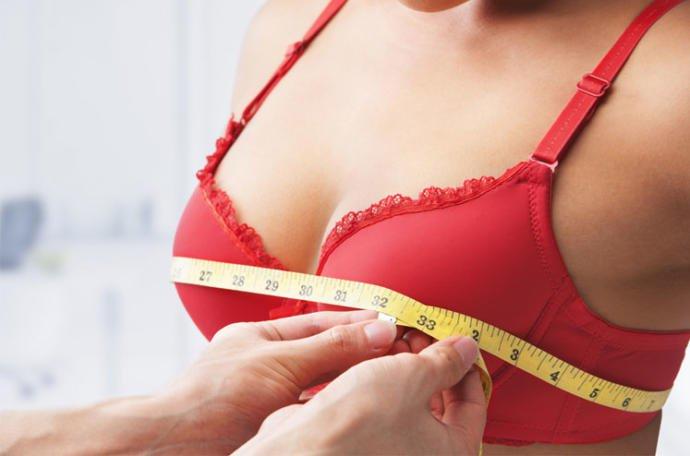 How should a small breasted girl feel if her boyfriend suggested she get a boob job?
