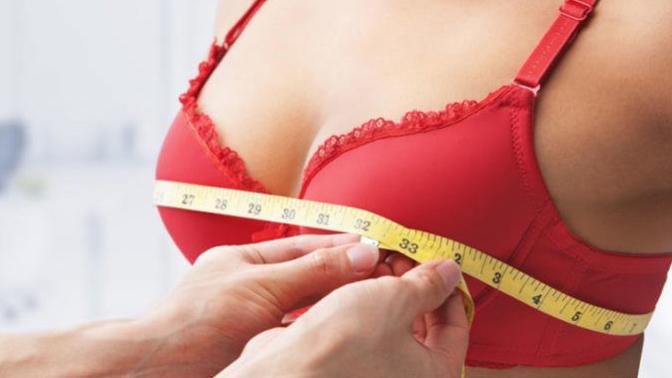 How should a small breasted girl feel if her boyfriend suggested she get a boob job?