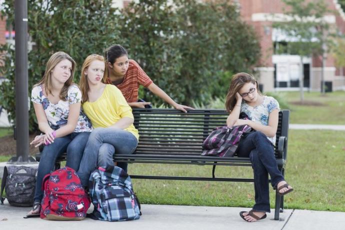 Why are non-stereotypical traits in females looked down upon by other females?