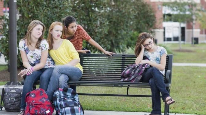 Why are non-stereotypical traits in females looked down upon by other females?