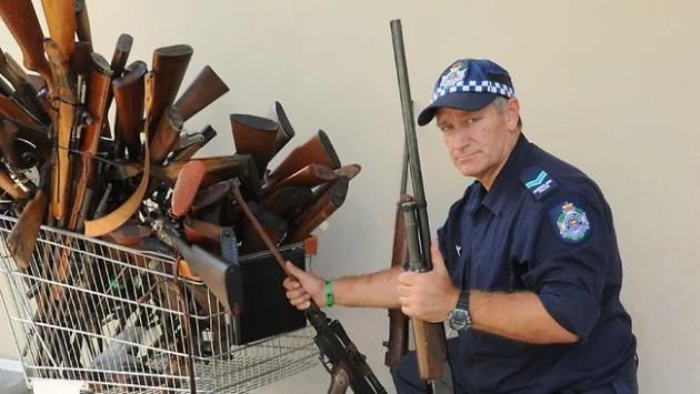 Why do you think this man has a shopping cart full of guns?