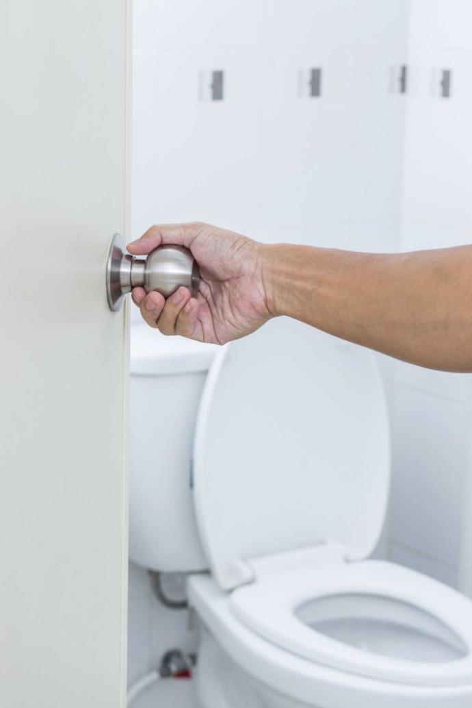 Is it fine for a partner to use the toilet with the door open?