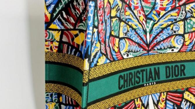 Why is Dior book tote bag so expensive?