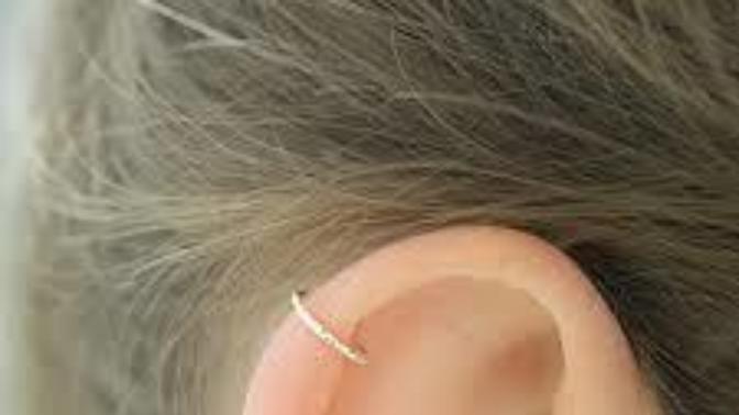 Which one looks better, the ear piercing or the lip piercing?