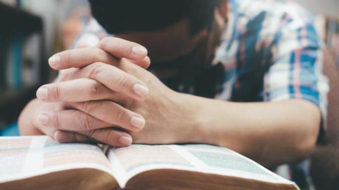 Does believing in God make a person less intelligent?
