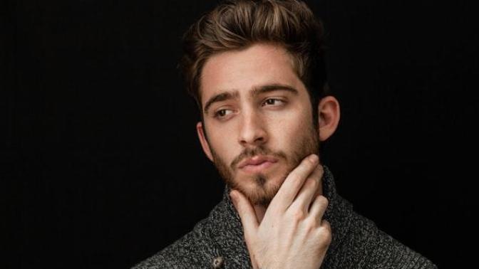 Why are people less judgmental of good looking people?