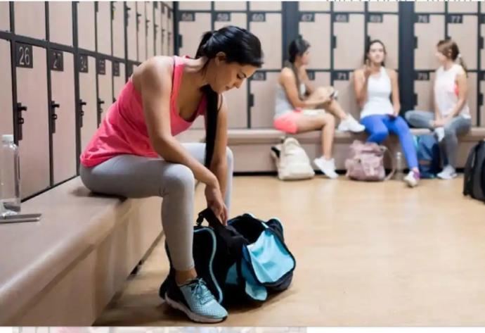 How to get over your embarrassment of being naked in gym changing rooms?