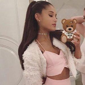 Is Ariana grande more hot or cute looking?