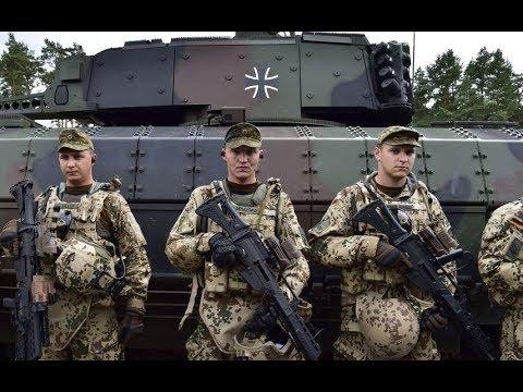 Bundeswehr with iron cross in the background.