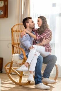 What do you think about sitting in your SOs lap at a family gathering, is it arkward or common practice?